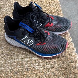 New Balance Black Running Shoes with Blue and Red Details
